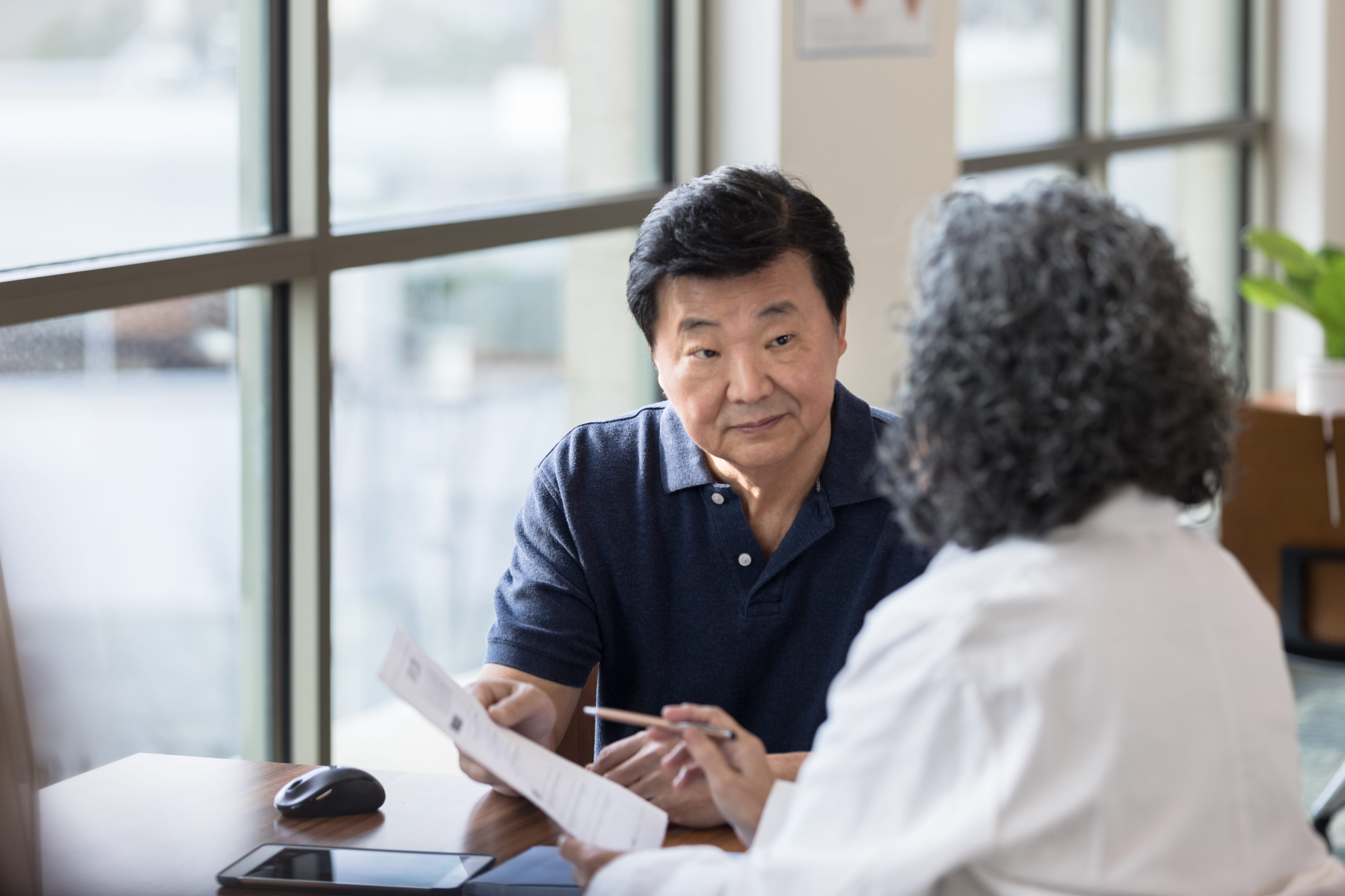 Asian male patient with female dr